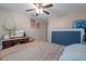 Cozy bedroom features beachy decor, soft carpet, and a comfortable bed at 8194 Sturbridge Ct # A, Weeki Wachee, FL 34613