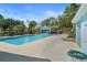 Community pool area featuring a large swimming pool and comfortable lounge chairs at 8194 Sturbridge Ct # A, Weeki Wachee, FL 34613