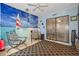 Relaxing Florida room featuring a beach mural, comfortable seating, and a view of the outdoors at 8194 Sturbridge Ct # A, Weeki Wachee, FL 34613