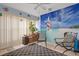 Inviting Florida room with bright décor, tile flooring, comfortable seating, and natural light at 8194 Sturbridge Ct # A, Weeki Wachee, FL 34613