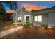 Charming home exterior featuring landscaped yard, walkway lights, and unique architectural details at 8194 Sturbridge Ct # A, Weeki Wachee, FL 34613