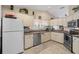 Bright kitchen features stainless steel appliances, ample cabinet space, and tile flooring at 8194 Sturbridge Ct # A, Weeki Wachee, FL 34613