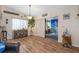 Open-concept living area with wood-look floors, backyard views, and a seamless flow for entertaining at 8194 Sturbridge Ct # A, Weeki Wachee, FL 34613