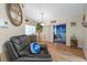 Cozy living room showcasing comfortable seating, wood-look flooring, and serene backyard views at 8194 Sturbridge Ct # A, Weeki Wachee, FL 34613