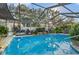 Relaxing screened pool area, perfect for outdoor enjoyment at 8434 Hazelton St, Spring Hill, FL 34608