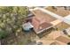 This aerial view highlights the home, large lot, sunroom and screened in porch at 8464 Dirlenton Way, Weeki Wachee, FL 34613