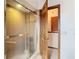 Bathroom with an enclosed shower and neutral tiling at 8464 Dirlenton Way, Weeki Wachee, FL 34613