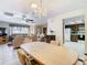 Open-concept design: dining area seamlessly connects to living room and kitchen at 8464 Dirlenton Way, Weeki Wachee, FL 34613