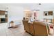 Cozy living room featuring tile flooring, neutral paint, and comfortable seating at 8464 Dirlenton Way, Weeki Wachee, FL 34613