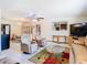 Bright living room featuring tile flooring, neutral paint, and comfortable seating at 8464 Dirlenton Way, Weeki Wachee, FL 34613