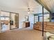 This sunroom has neutral carpeting and sliding glass doors at 8464 Dirlenton Way, Weeki Wachee, FL 34613