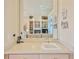 Wet bar area with granite countertops and a mirror reflecting the living room at 9091 Alexandria Dr, Weeki Wachee, FL 34613