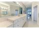 Large bathroom with and sinks. Notice the archway into the Primary bedroom sitting area at 9091 Alexandria Dr, Weeki Wachee, FL 34613