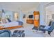 Cozy bedroom with sitting area, soft carpet and natural light, offering a relaxing retreat at 9091 Alexandria Dr, Weeki Wachee, FL 34613
