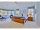 Bedroom with light blue walls, bay window, and carpet flooring, creating a serene and comfortable space at 9091 Alexandria Dr, Weeki Wachee, FL 34613