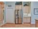 Kitchen with stainless steel refrigerator and wood cabinets provides plenty of storage space at 9091 Alexandria Dr, Weeki Wachee, FL 34613