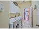 Laundry room with access to kitchen and updated washer and dryer for chores convenience at 9091 Alexandria Dr, Weeki Wachee, FL 34613