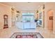 Spacious living room features tile floors, a fireplace, and access to the patio at 9091 Alexandria Dr, Weeki Wachee, FL 34613