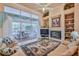 Spacious living room with a sliding glass door to the patio and a beautiful fireplace at 9091 Alexandria Dr, Weeki Wachee, FL 34613