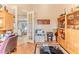 Bright office space featuring French doors, custom cabinetry, and a decorative rug at 9091 Alexandria Dr, Weeki Wachee, FL 34613