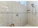 Shower room showcases neutral tile, a unique fixture, and practical storage at 9091 Alexandria Dr, Weeki Wachee, FL 34613