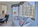 Bright sitting area overlooking a pool, with comfortable seating and natural light at 9091 Alexandria Dr, Weeki Wachee, FL 34613