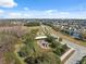 Extensive aerial view of the community showcasing the playground, lake, and well-kept landscaping at 18819 Sunterra Dr, Land O Lakes, FL 34638