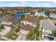 Aerial view of home showcasing backyard, landscaping and a nearby pond at 18819 Sunterra Dr, Land O Lakes, FL 34638