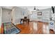 Bright bedroom featuring hardwood floors, plantation shutters, and a ceiling fan at 18819 Sunterra Dr, Land O Lakes, FL 34638