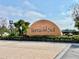 Tierra del Sol community sign with lush landscaping on a sunny day at 18819 Sunterra Dr, Land O Lakes, FL 34638
