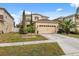 Charming two-story home with a two-car garage and well-kept front yard at 18819 Sunterra Dr, Land O Lakes, FL 34638