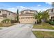 Two-story home featuring well-maintained lawn and a two-car garage at 18819 Sunterra Dr, Land O Lakes, FL 34638