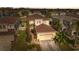 Well-manicured two-story home with mature landscaping and a two-car garage at 18819 Sunterra Dr, Land O Lakes, FL 34638