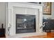 Close up of the fireplace, featuring a decorative mantelpiece and elegant marble surround at 18819 Sunterra Dr, Land O Lakes, FL 34638