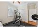 Home gym with weight training equipment and rubber flooring at 18819 Sunterra Dr, Land O Lakes, FL 34638