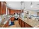 Well-appointed kitchen featuring granite countertops, stainless steel appliances, and custom cabinetry at 18819 Sunterra Dr, Land O Lakes, FL 34638