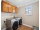 Laundry room with modern stainless-steel washer and dryer at 18819 Sunterra Dr, Land O Lakes, FL 34638
