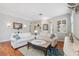 Inviting living room with hardwood floors, comfortable seating, and decor that complements the space at 18819 Sunterra Dr, Land O Lakes, FL 34638