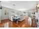 Open-concept living room with hardwood floors and modern decor at 18819 Sunterra Dr, Land O Lakes, FL 34638