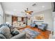 View of the living area that connects to an open-plan kitchen and dining space with seamless flow at 18819 Sunterra Dr, Land O Lakes, FL 34638