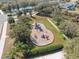 Aerial view of the community playground with colorful slides, swings, and climbing structures at 18819 Sunterra Dr, Land O Lakes, FL 34638