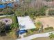 Aerial view of the sand volleyball court, picnic shelter, and playground in the community area at 18819 Sunterra Dr, Land O Lakes, FL 34638