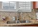 Kitchen sink with granite countertops and stainless faucet at 18819 Sunterra Dr, Land O Lakes, FL 34638