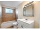 Bathroom with tiled shower and tub, along with a sink and vanity at 10841 Piccadilly Rd, Port Richey, FL 34668