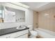 Bathroom featuring a shower-tub combo, sink, and tile floors at 10841 Piccadilly Rd, Port Richey, FL 34668