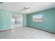 Bedroom featuring tiled floors and sliding glass doors at 10841 Piccadilly Rd, Port Richey, FL 34668