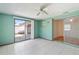 Tiled bonus room with sliding glass doors at 10841 Piccadilly Rd, Port Richey, FL 34668