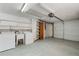 Garage interior features laundry units, utility sink, and storage shelves at 10841 Piccadilly Rd, Port Richey, FL 34668