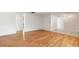 Clean and well-lit living room with hardwood floors and neutral colors at 10841 Piccadilly Rd, Port Richey, FL 34668