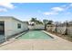 Backyard pool, perfect for a summer day and outdoor entertainment, with a fenced-in yard for privacy at 10841 Piccadilly Rd, Port Richey, FL 34668